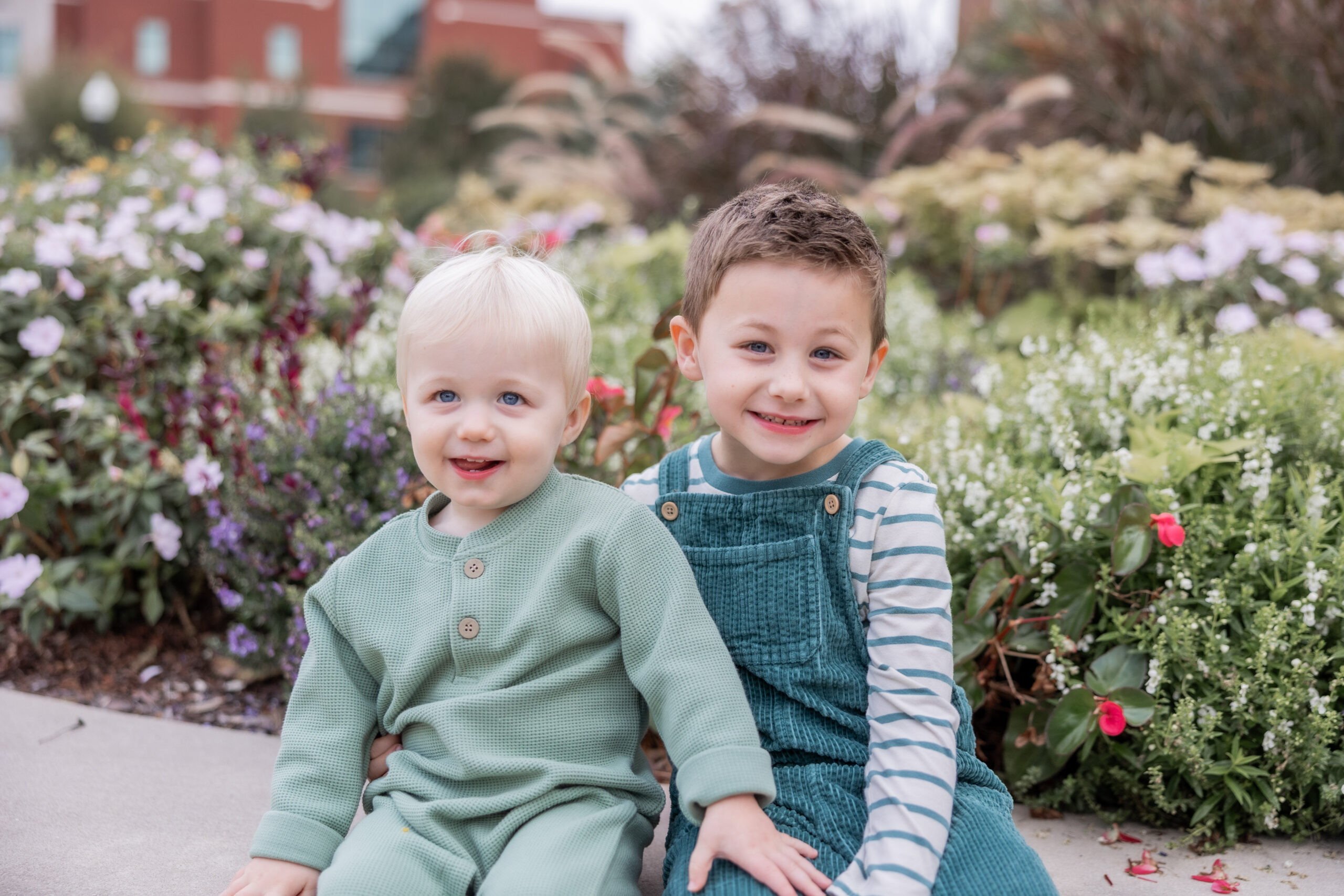 Starkville family posing for pictures on Mississippi State University Campus