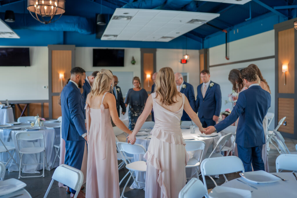 bride and groom praying before the ceremony at destination wedding in Nashville