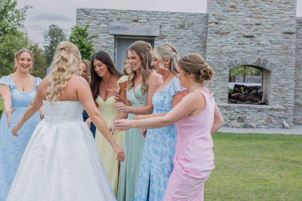 Bride and bridal party at a wedding Flowers in Starkville, Mississippi at The Hill and Moor.