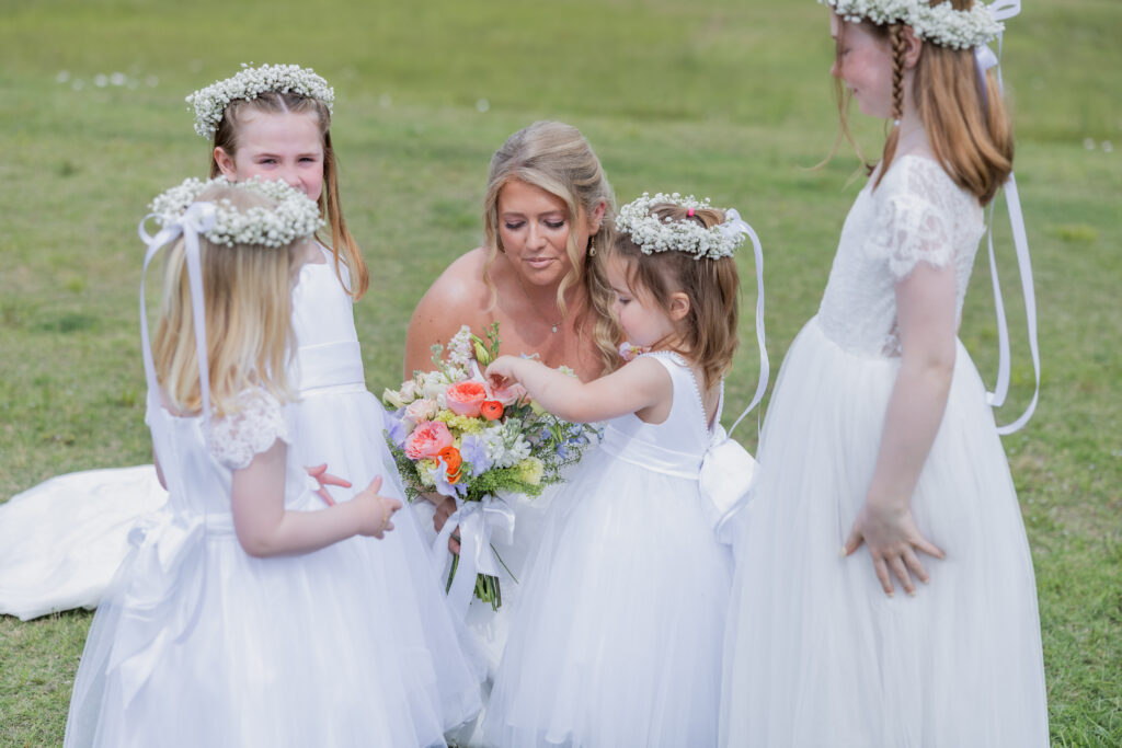 Bride and bridal party at a wedding Flowers in Starkville, Mississippi at The Hill and Moor.