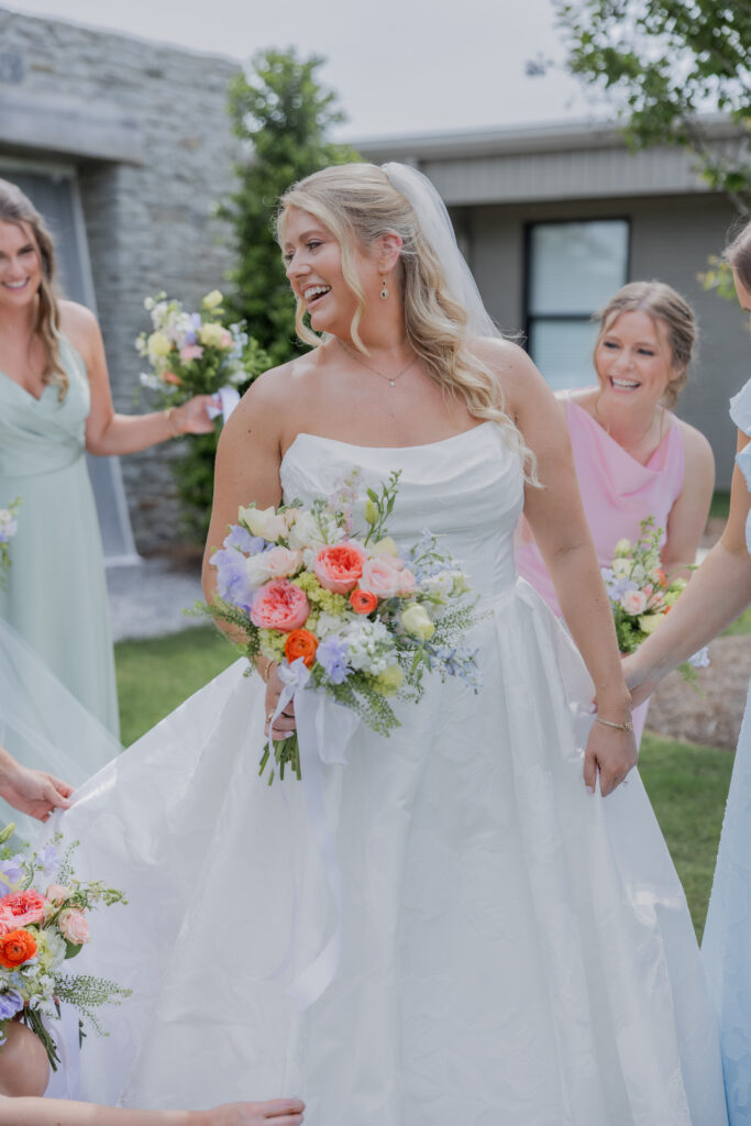 Bride and bridal party at a wedding Flowers in Starkville, Mississippi at The Hill and Moor.